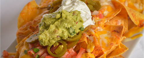 Tray of Nachos at Guadalajara Grill, Bar, & Table Side Salsa in Tucson Arizona. Tray of Nachos at Guadalajara Grill, Bar, & Table Side Salsa in Tucson Arizona.
